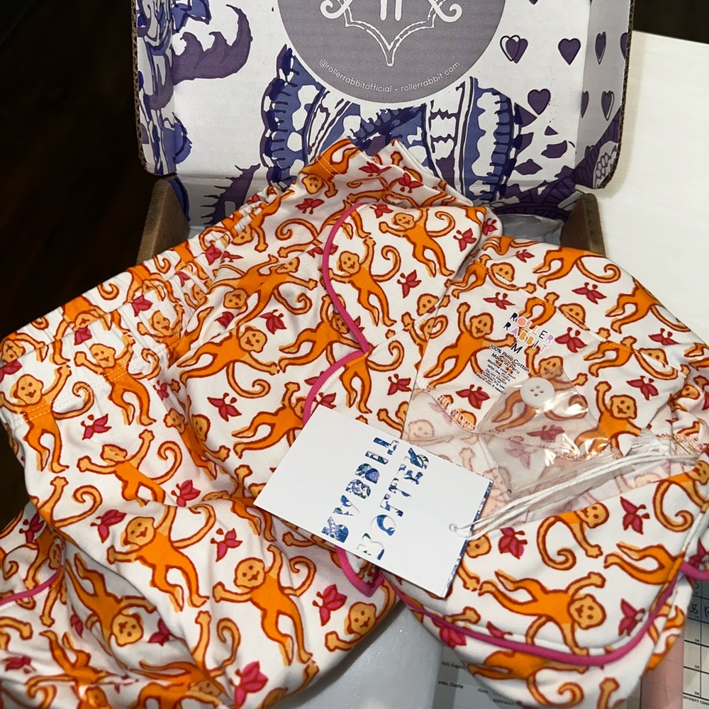 NWT orange monkey pjs size medium.